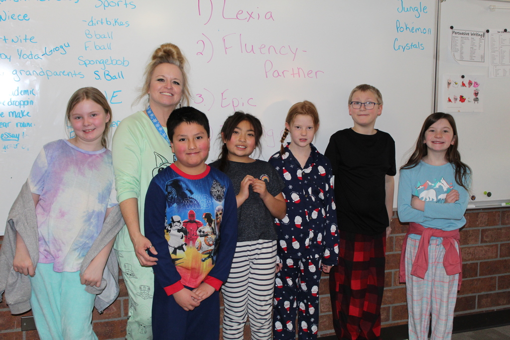 BUE students and teacher in pajamas